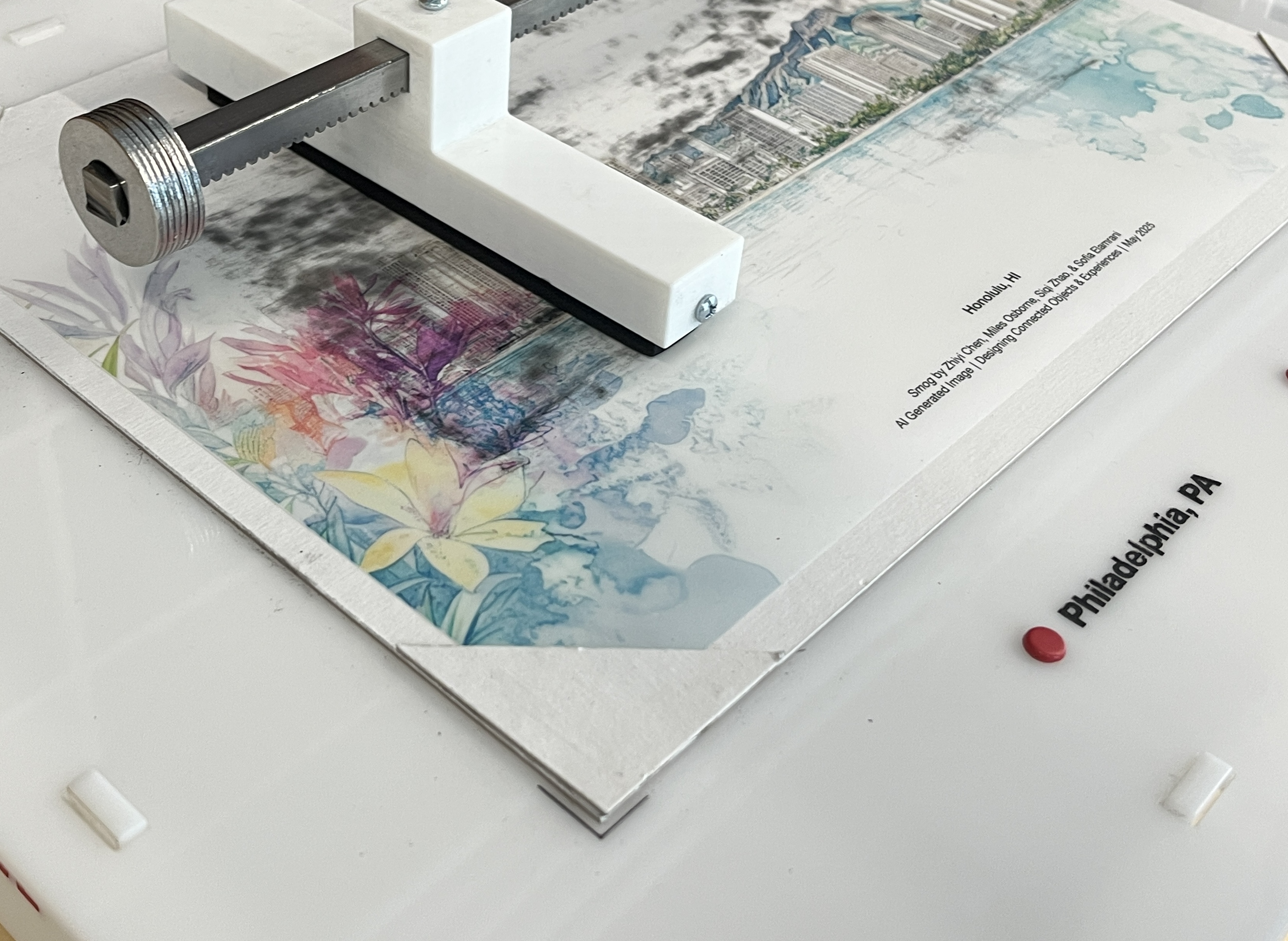 The rack-and-pinion carriage and charcoal holder resting on the Honolulu print.
